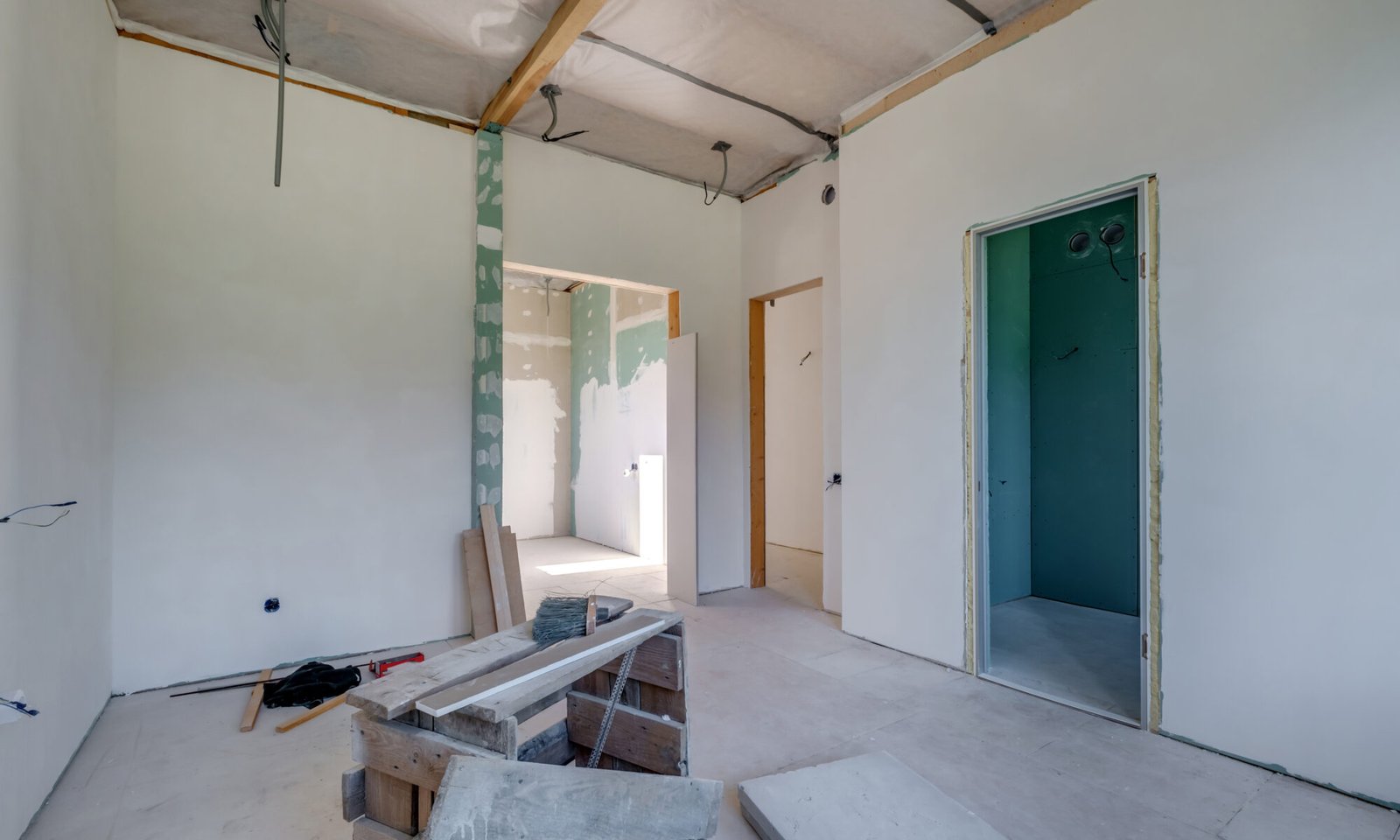 empty white green drywall room with repair and without furniture